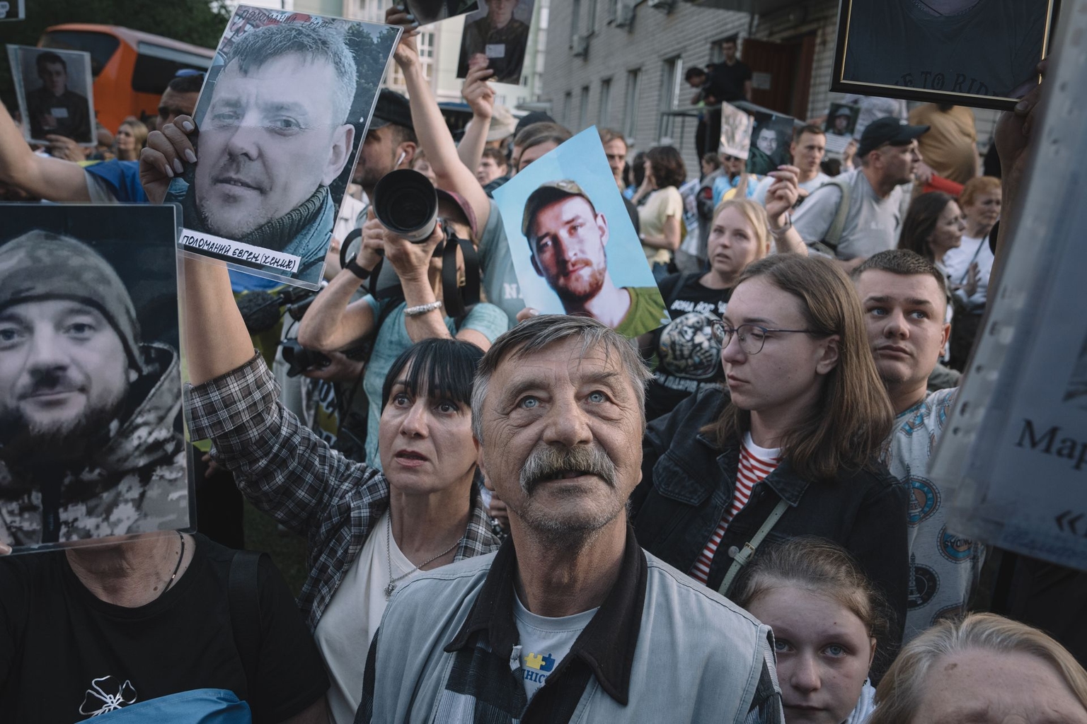 Relatives and military personnel welcome Ukrainian servicemen following a major prisoner of war swap with Russia at an undisclosed location in Ukraine.