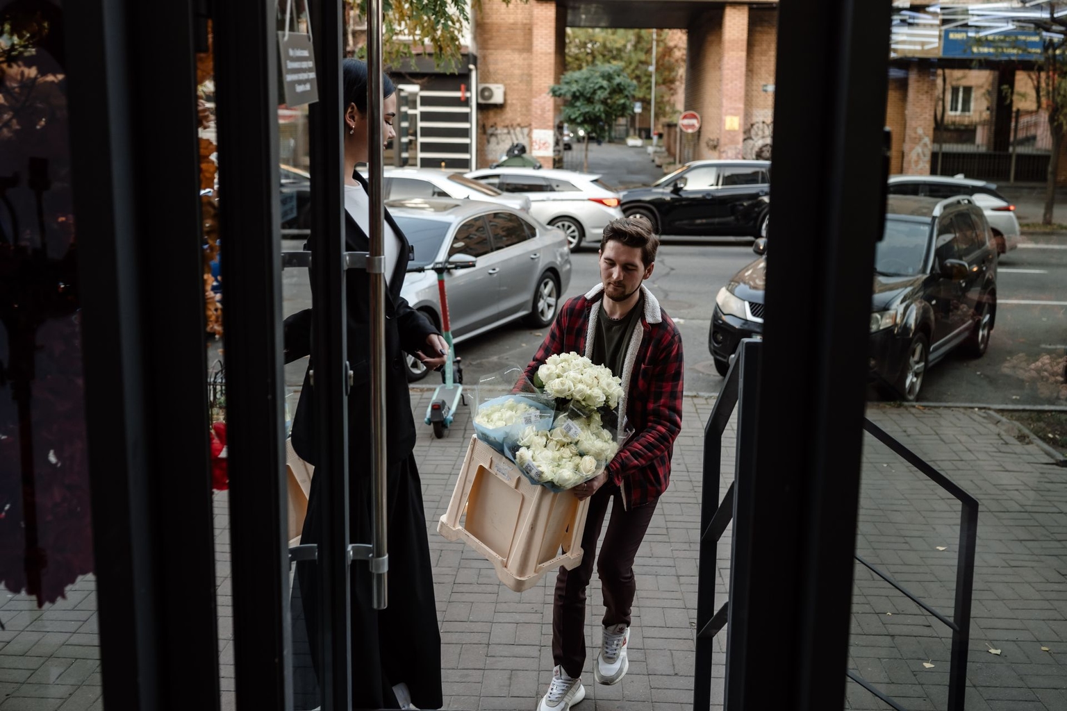 Orest Kovalyshyn, director of the Flora de Luxe flower shop chain, carries roses into one of his shops in Kyiv, Ukraine, on Nov. 7, 2024.