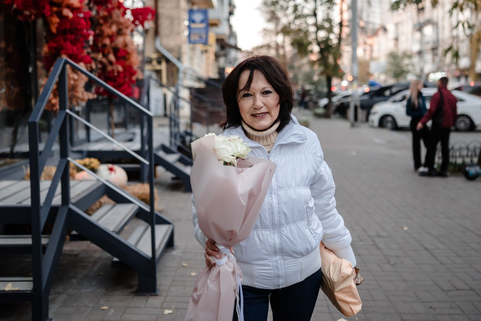 Olena Holovach outside a Flora de Luxe flower shop after buying roses for her sister in Kyiv, Ukraine, on Nov. 7, 2024.