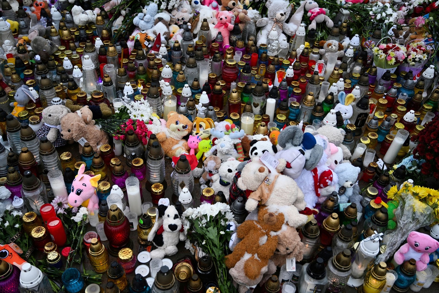 A makeshift memorial at the site of a Russian strike on a residential multi-story building in Ternopil, Ukraine, on Nov. 22, 2025. 