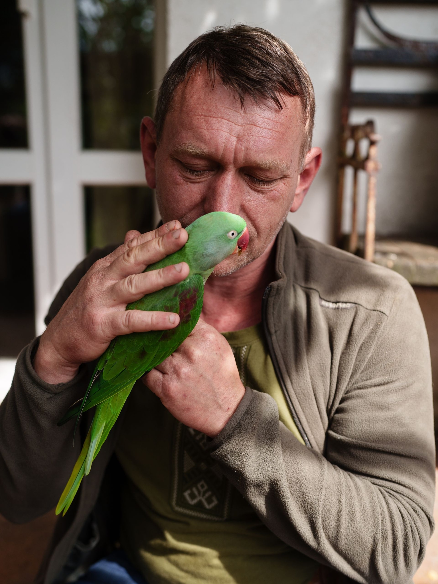 Viktor Shelvinsky, founder of the Free Wings rehabilitation center, tends to rescued birds in Kozhychi, Lviv Oblast, Ukraine, on Aug. 27, 2025.