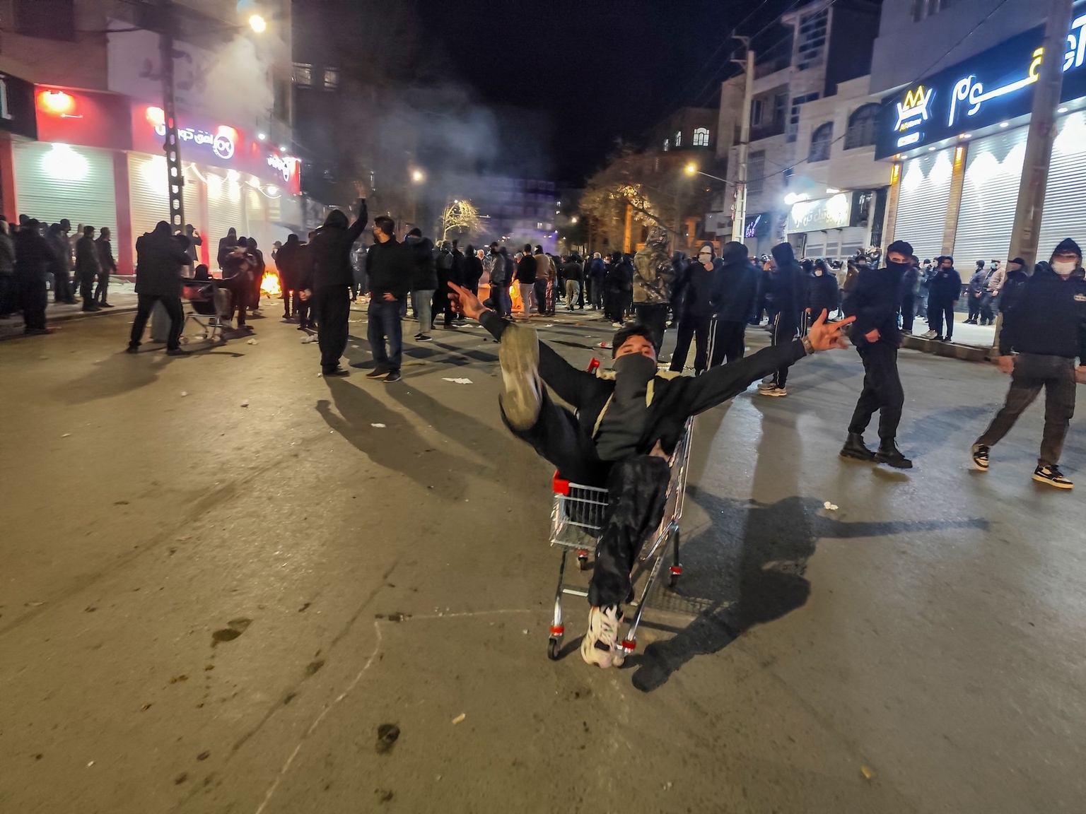 Iranians block a street during a protest in Kermanshah, Iran, on Jan. 8, 2026, as nationwide demonstrations spread over economic and political grievances.