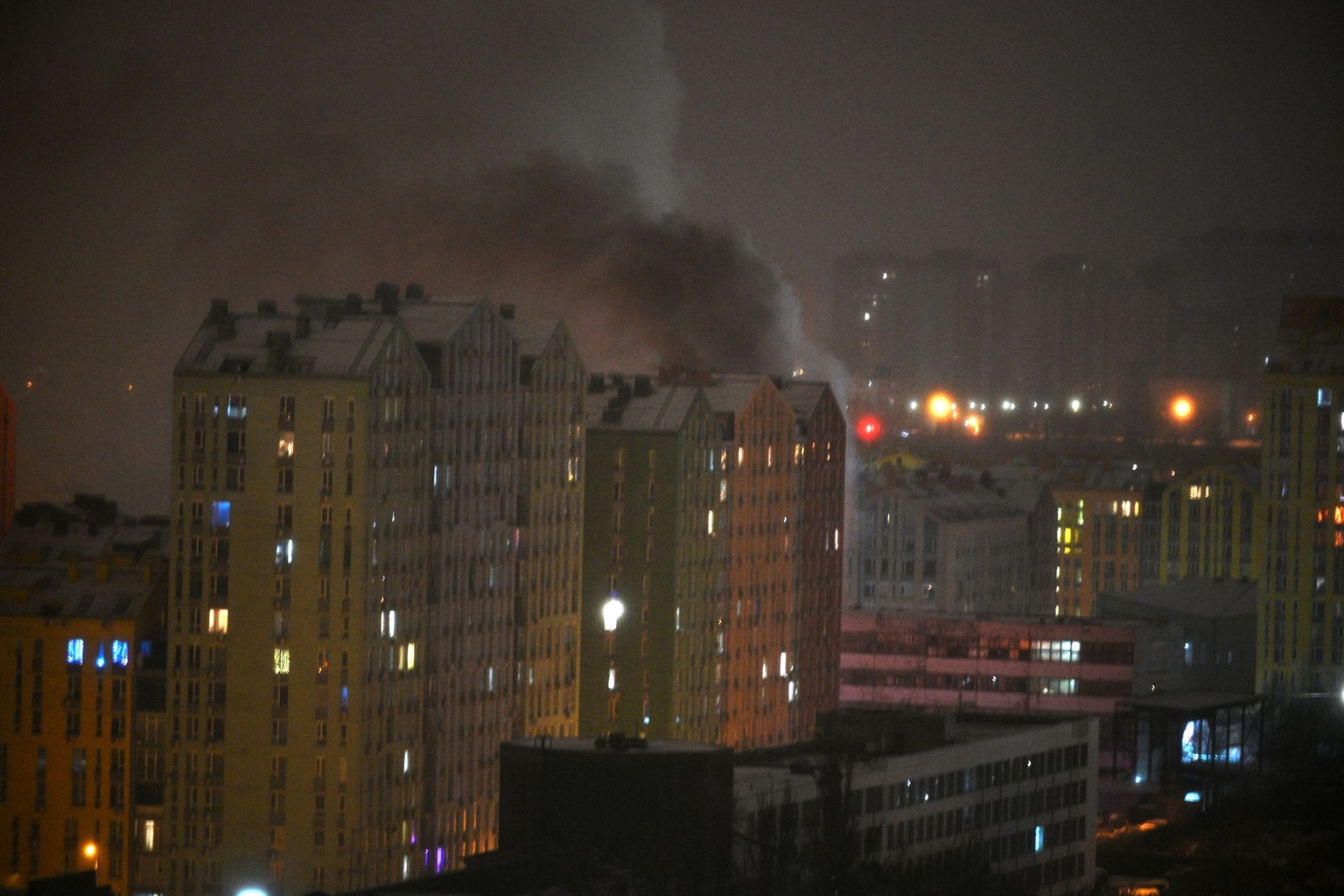 Smoke rises from a building after Russian drone and missile strikes hit Kyiv, Ukraine, on Jan. 9, 2026