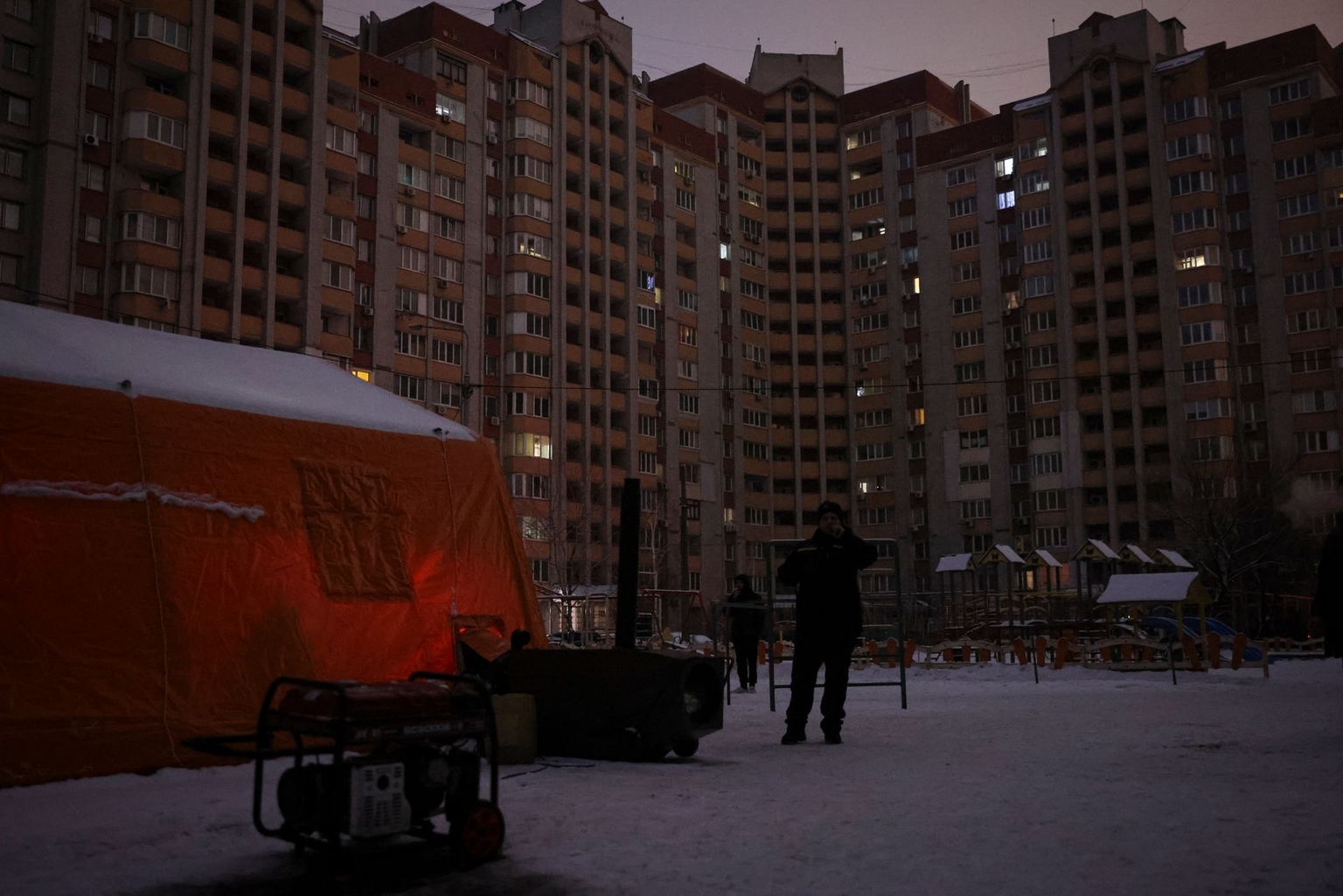 Residents warm themselves and charge their phones at a Point of Invincibility in Kyiv, Ukraine, on Jan. 14, 2026