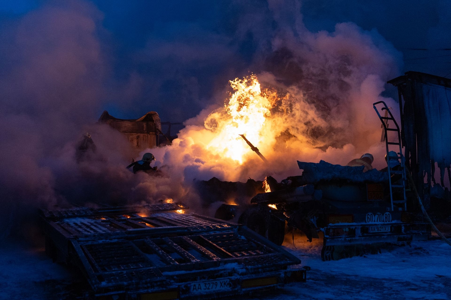 Ukrainian emergency personnel work to extinguish a fire at the site of an air attack in Kyiv, Ukraine, on Jan. 24, 2026