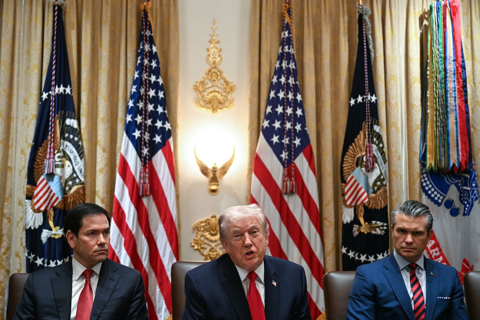 U.S. President Donald Trump (C) speaks alongside Secretary of State Marco Rubio (L) and Defense Secretary Pete Hegseth (R) in Washington, D.C., on Jan. 29, 2026.