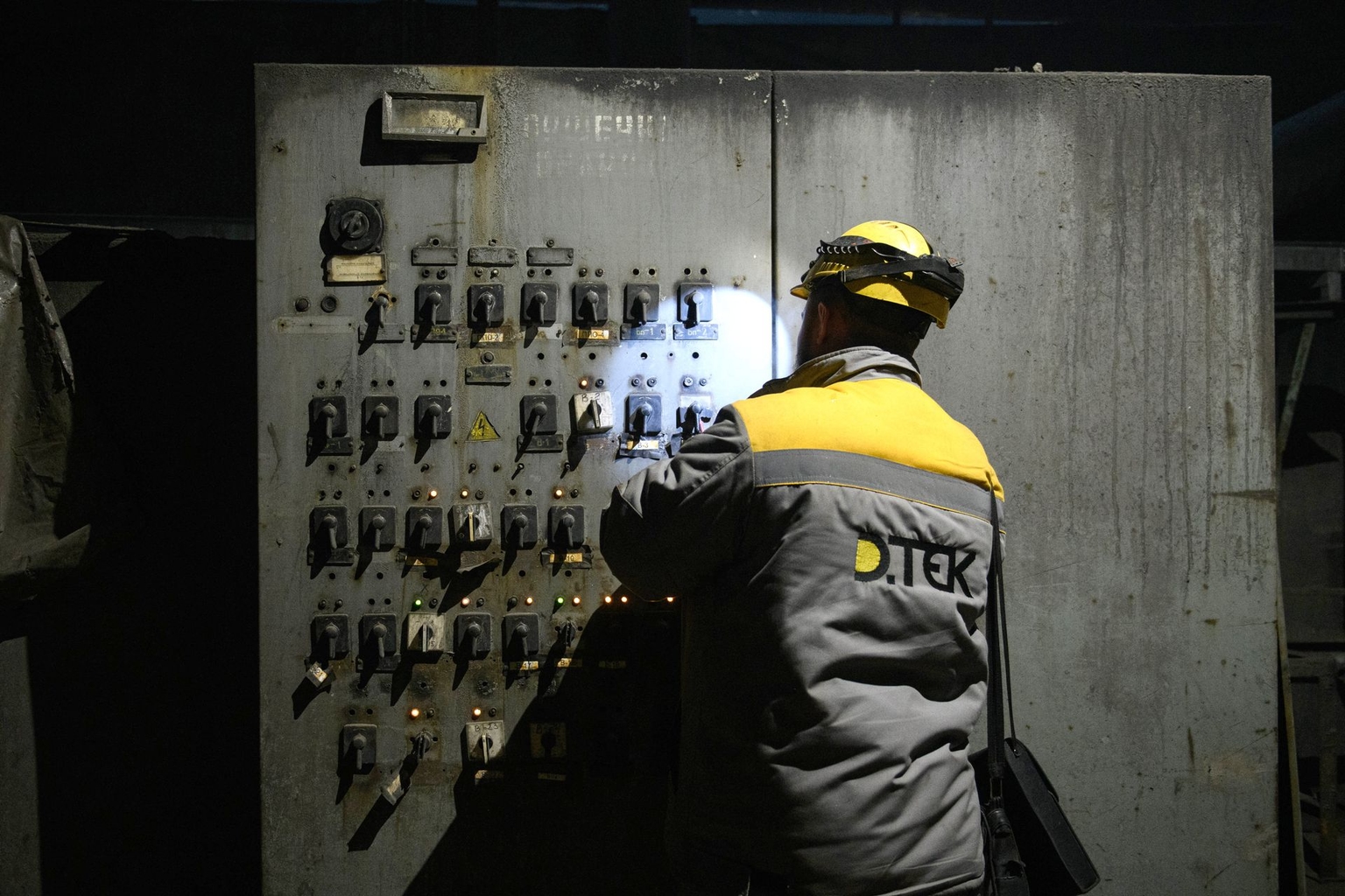 A DTEK worker carries out electrical repair operations at a thermal power plant damaged by Russian missile attacks at an undisclosed location in Ukraine, on Nov. 28, 2024. 