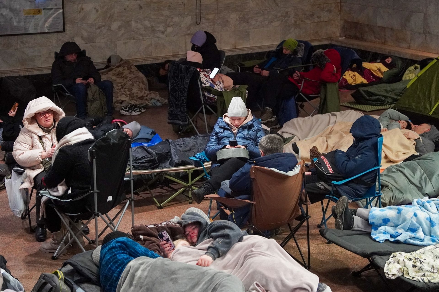 People take shelter at a metro station during a Russian air attack in Kyiv, Ukraine, early on Feb. 3, 2026. 