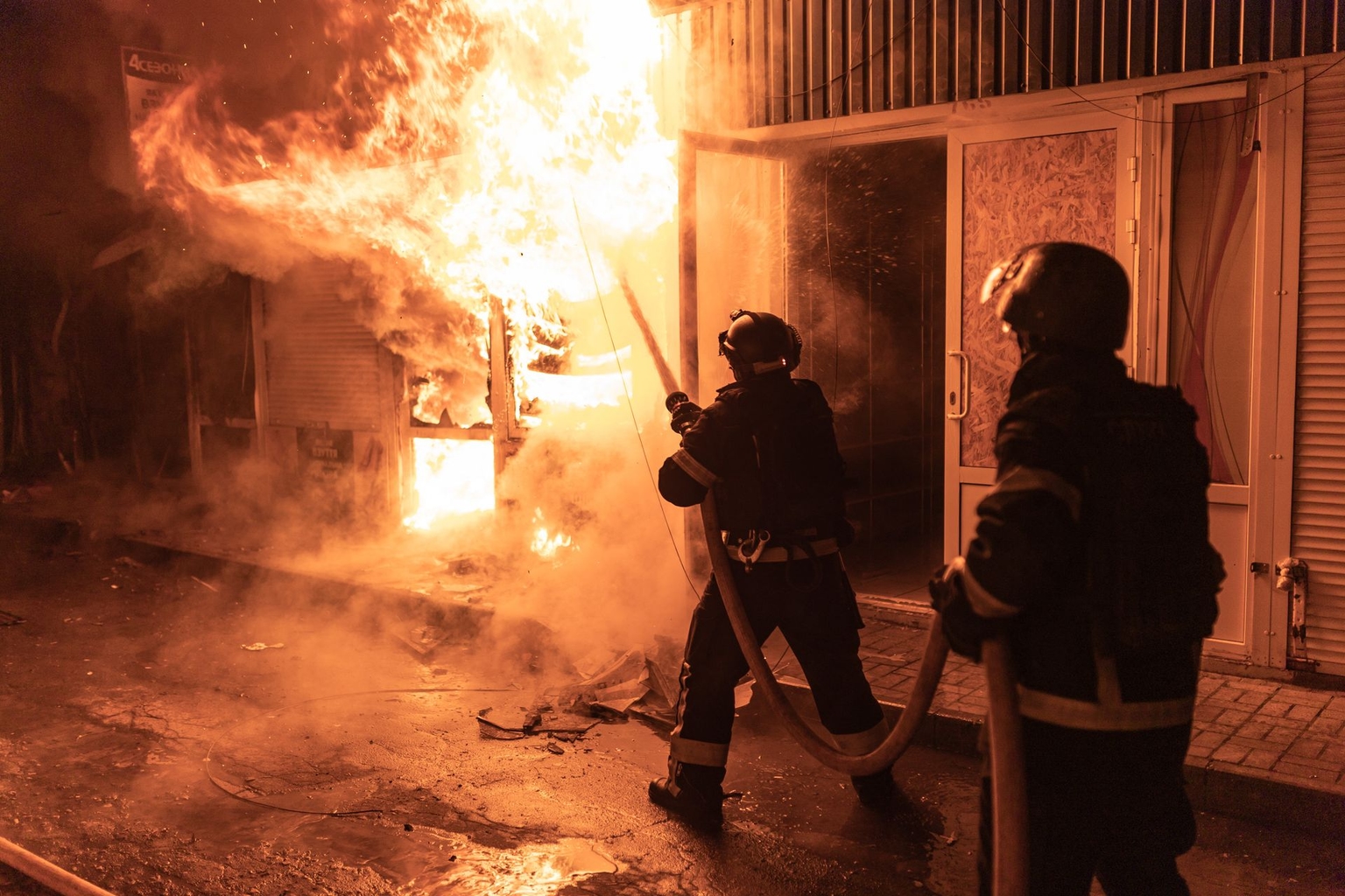 Firefighters extinguish a fire after a strike by a Russian drone at a market in Kramatorsk, Donetsk Oblast, Ukraine, on Feb. 3, 2026. 