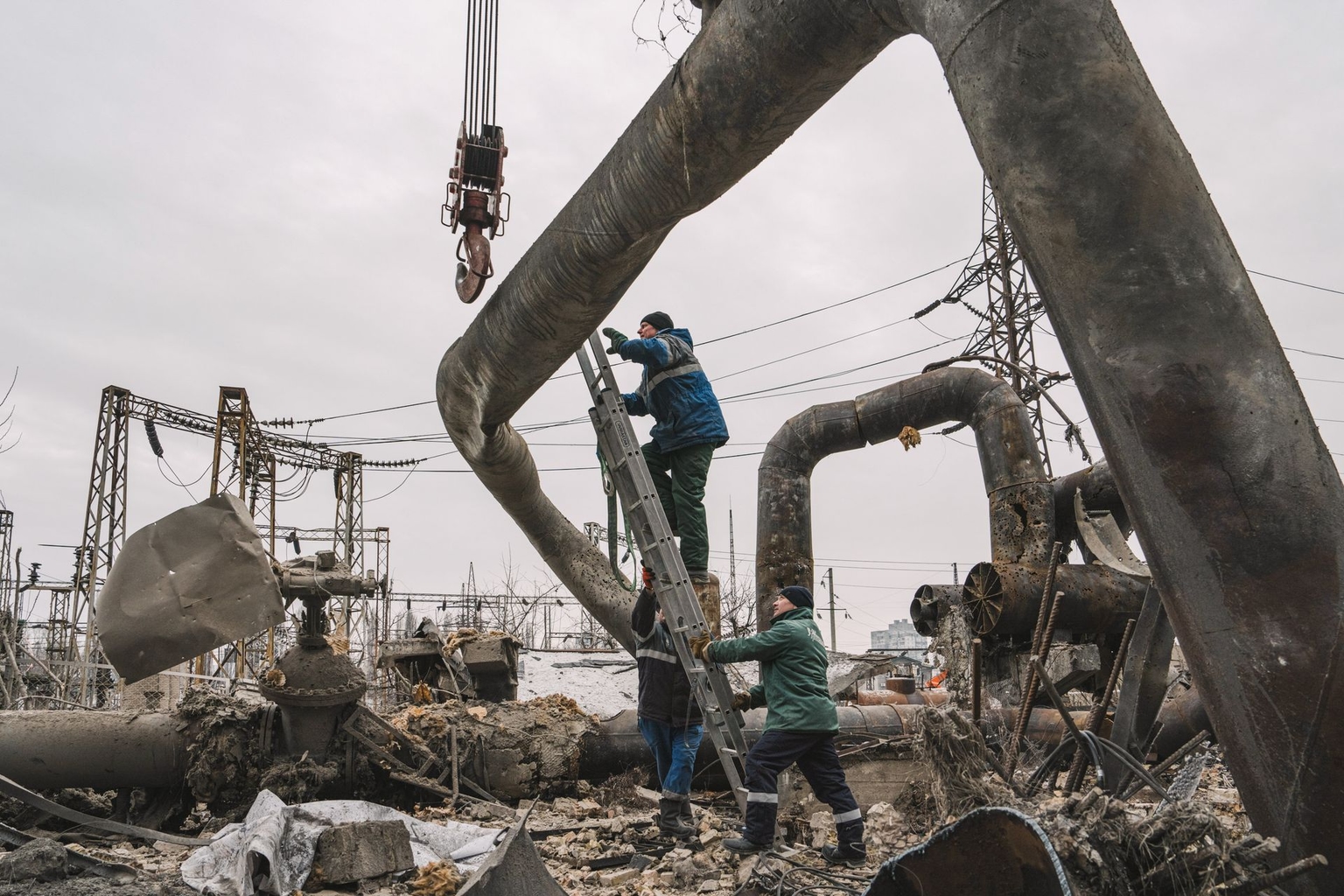 Workers clear damaged pipes at the Darnytsia Thermal Power Plant after Russian airstrikes in Kyiv, Ukraine, on Feb. 4, 2026.