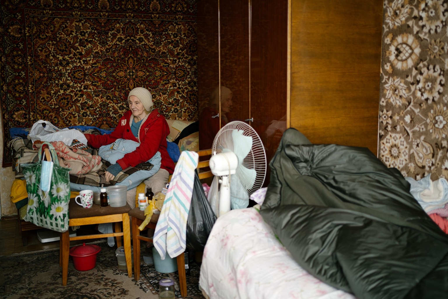 Maria Samii, 77, who cannot walk and spends most of her time in bed, is seen in her apartment on the Left Bank of Kyiv, Ukraine, on Jan. 27, 2026. 