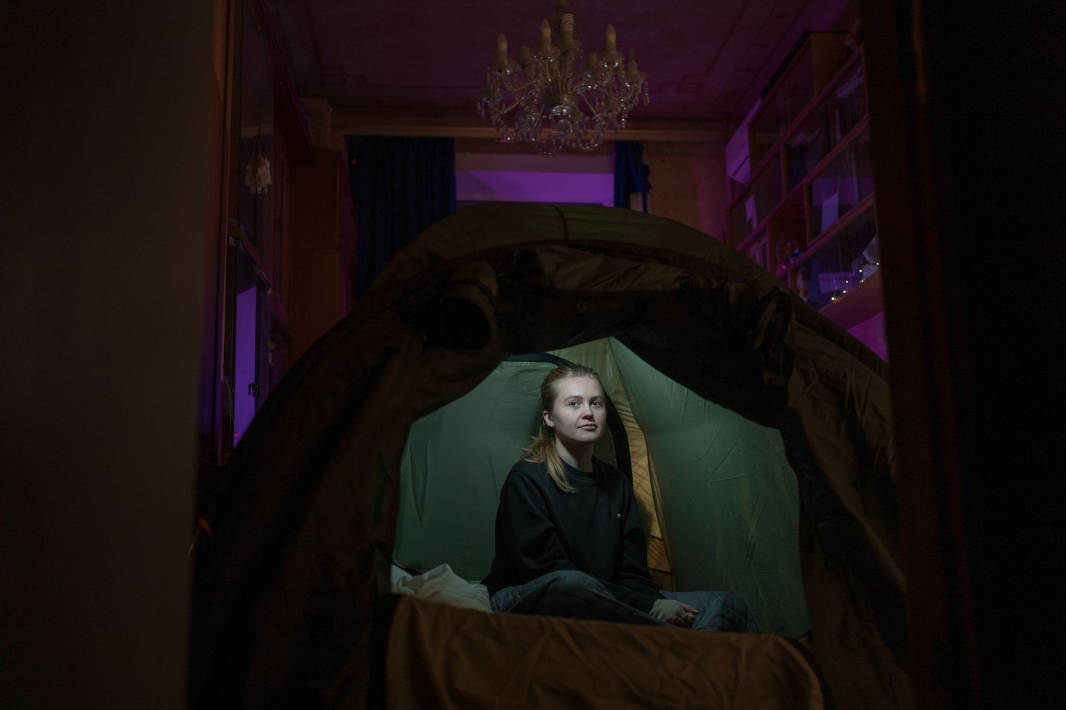 The Kyiv Independent Junior Marketing Analyst Mariia Borodulia in the tent inside her apartment in Kyiv, Ukraine, on Jan. 14, 2026.