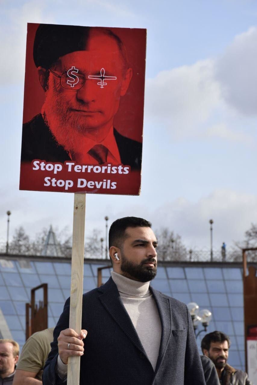 Maziyar, an Iranian who moved to Ukraine in 2006 to study in Kharkiv and later settled in Kyiv, takes part in a protest in Kyiv, Ukraine, in 2022. 