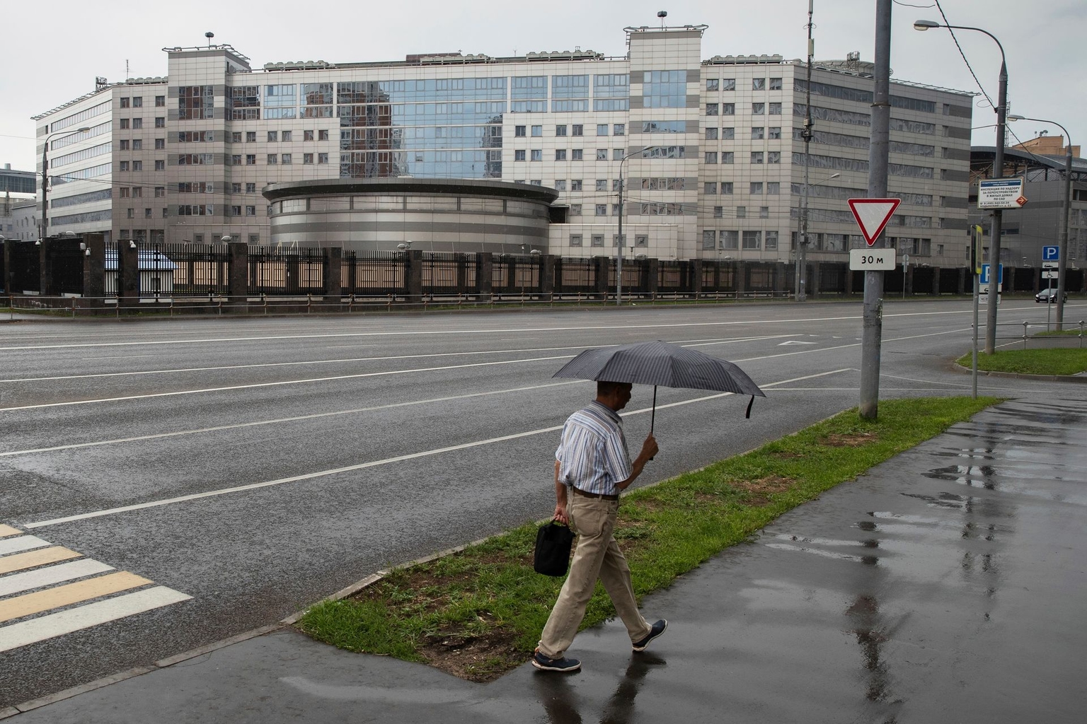 A man walks past the building of Russia’s military intelligence service in Moscow, Russia, on July 14, 2018. 