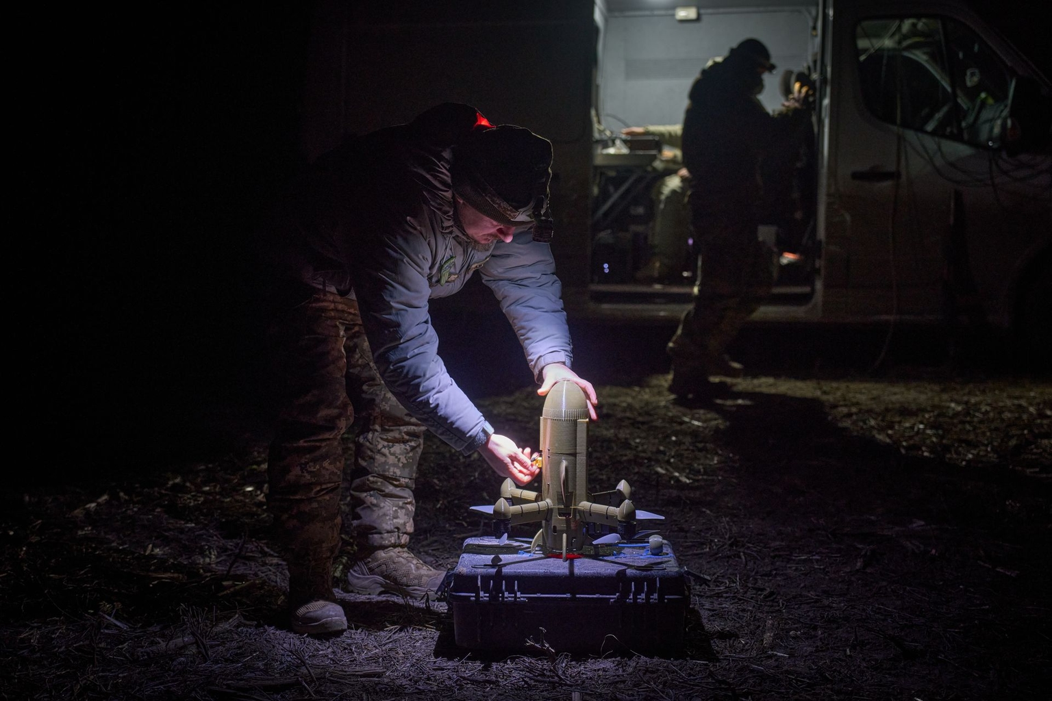 A Ukrainian soldier prepares an interceptor drone during Russia's aerial attack in an undisclosed location in Ukraine, on Dec. 13, 2025.