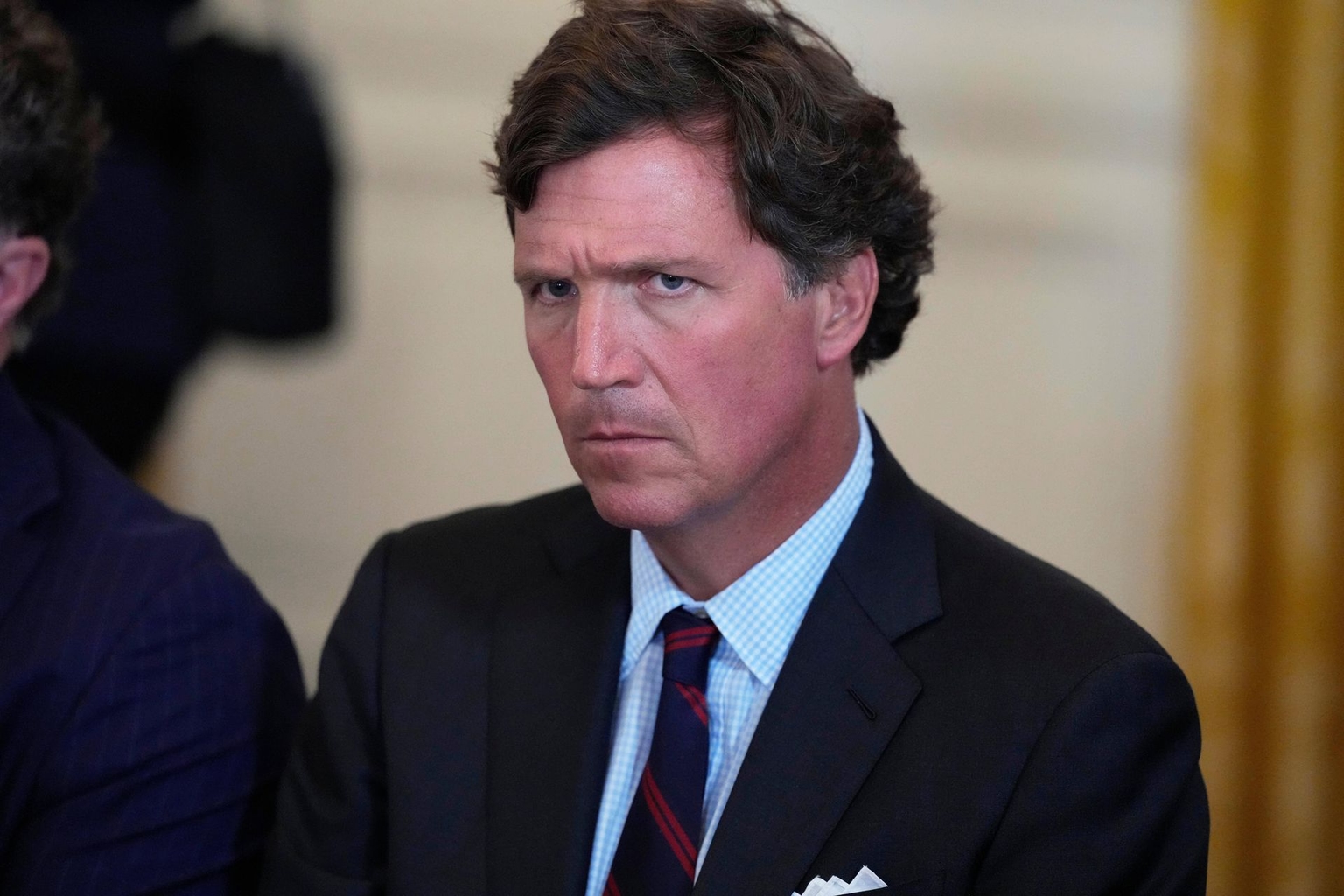 Tucker Carlson attends a meeting with U.S. President Donald Trump and oil executives in the East Room of the White House in Washington, DC, U.S., on Jan. 9, 2026