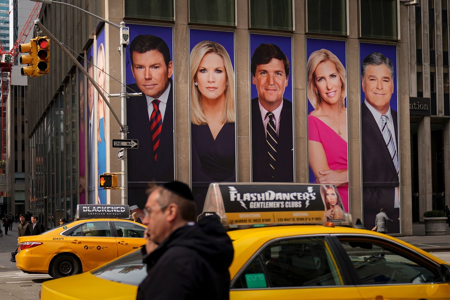 Fox News personalities, including (L-R) Bret Baier, Martha MacCallum, Tucker Carlson, Laura Ingraham, and Sean Hannity, on the News Corporation building in New York City, U.S., on March 13, 2019. 