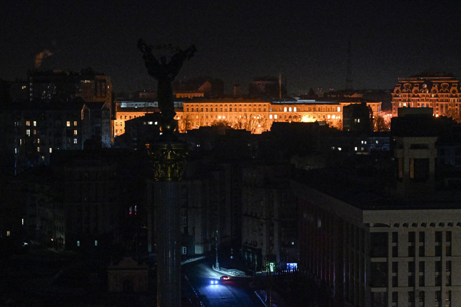 Cars drive through Independence Square during a power outage in Kyiv, Ukraine, on Jan. 20, 2026, amid the Russian invasion. 
