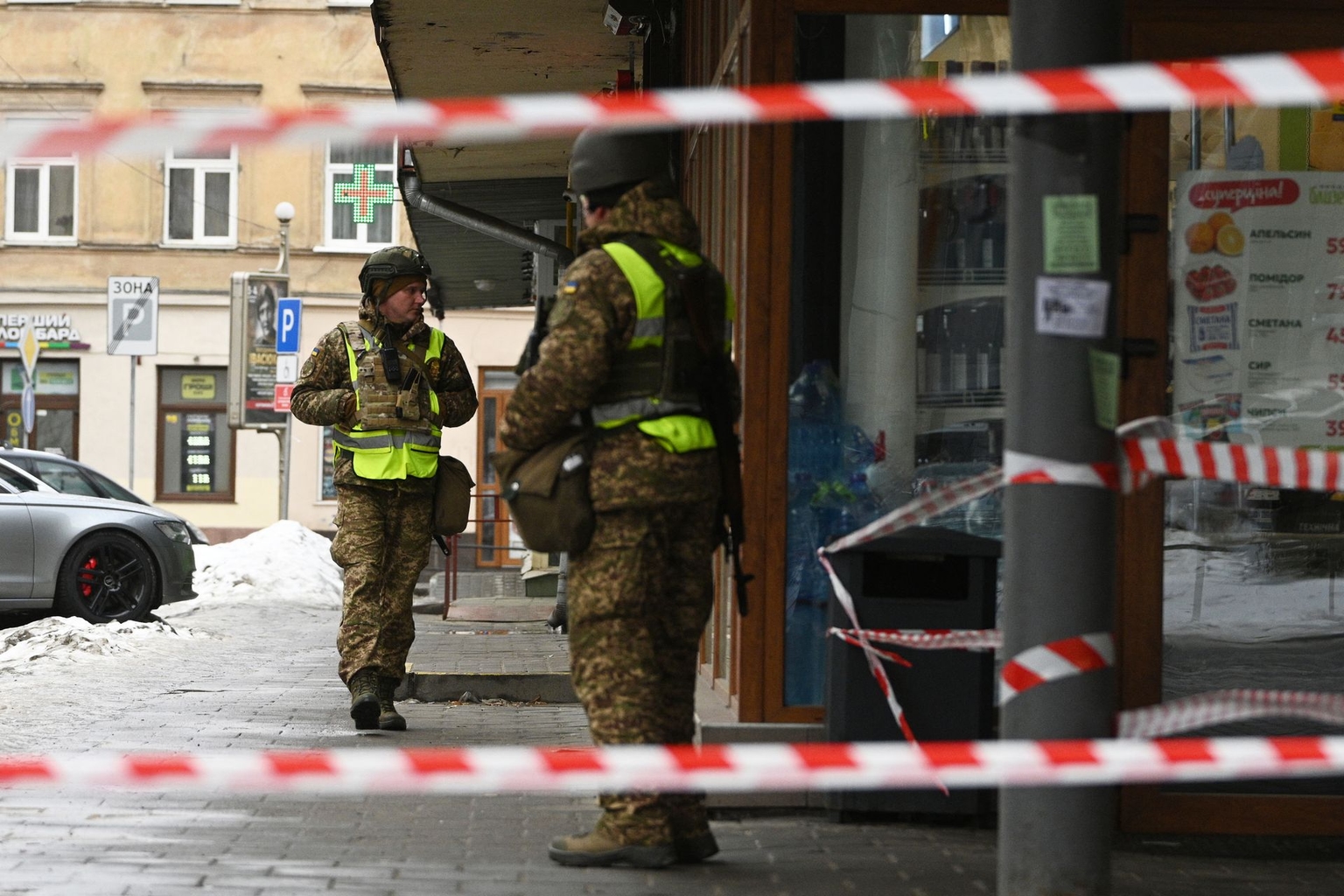 Ukrainian law enforcement officers secure the area at the site of an explosion that struck Lviv, Ukraine, on Feb. 22, 2026