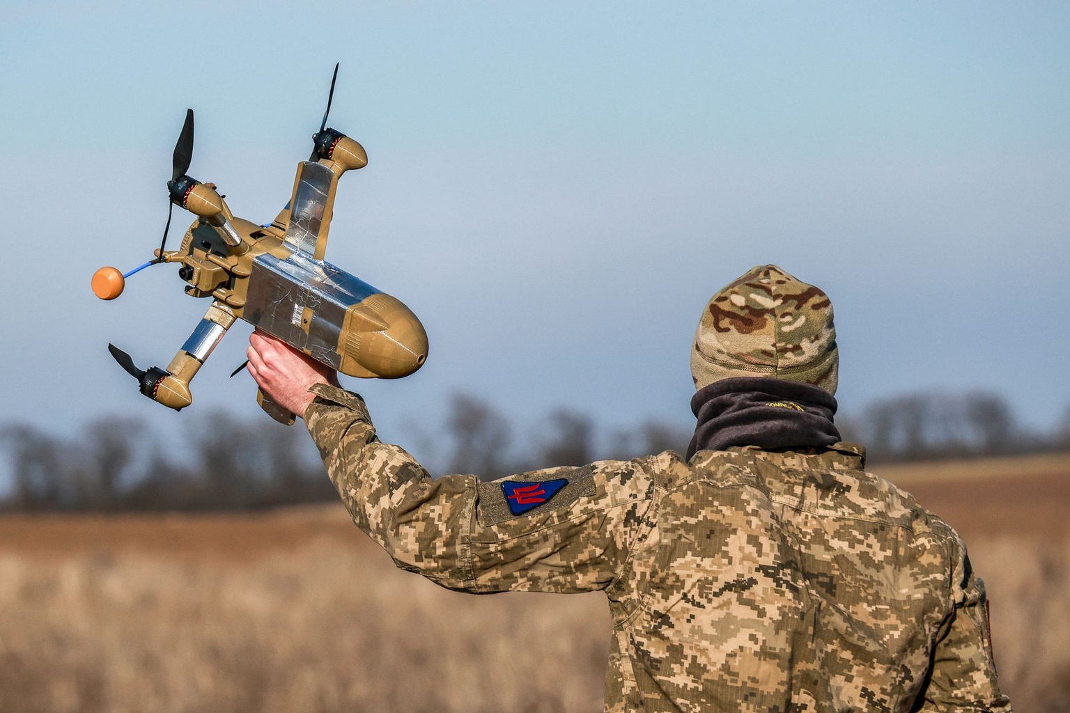 A serviceman from 208th Khersonska Anti-Aircraft Missile Brigade holds an interceptor drone during combat operations in an unnamed location, Ukraine, on March 4, 2026.