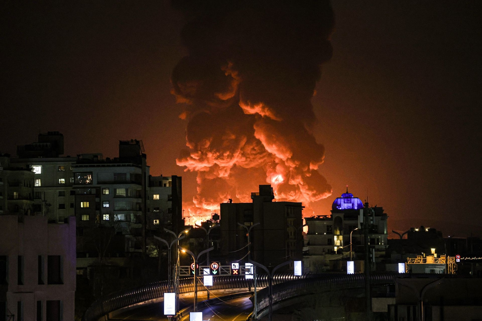 A large plume of smoke rises over Tehran after explosions were reported in the city during the night in Tehran, Iran, on March 7, 2026.