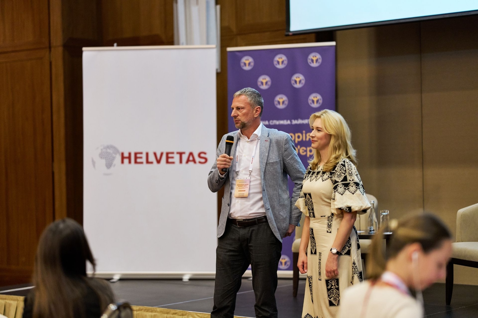 Petr Base (L), country director of Helvetas in Ukraine, and Yuliia Zhovtiak (R), director of the State Employment Service, attend the presentation of the Ukraine Labour Market Assessment 2024–2025 in Kyiv, Ukraine, in 2025. 
