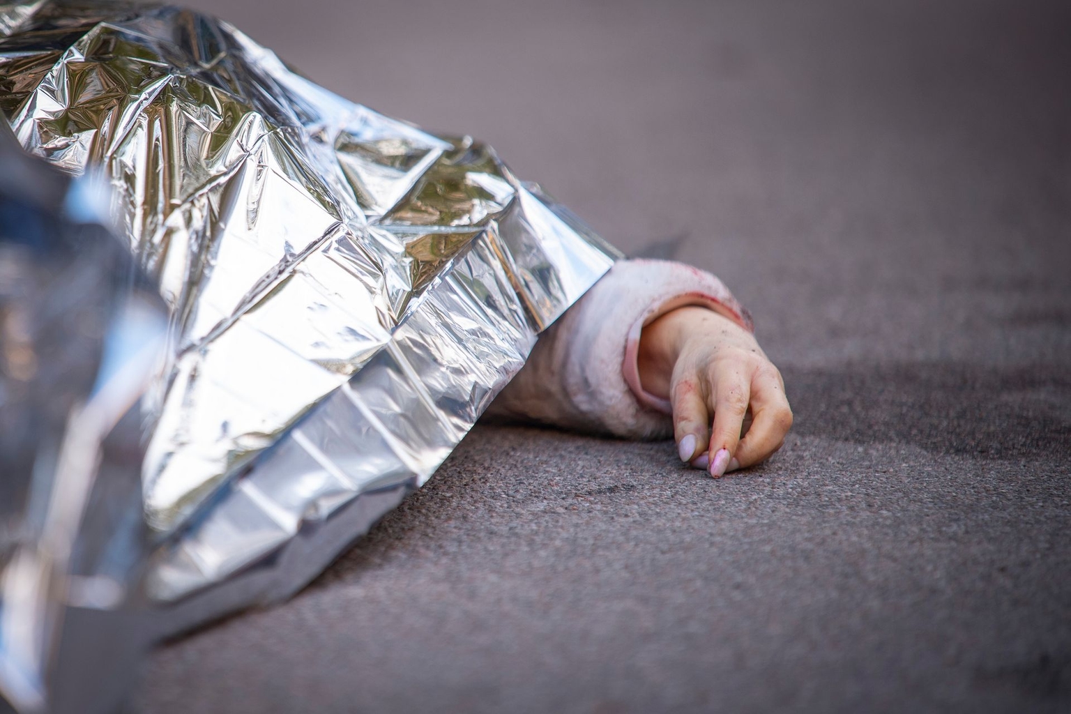 A body is seen at the scene where a gunman killed at least six people before being shot dead by police in Kyiv, Ukraine, on April 18, 2026. 