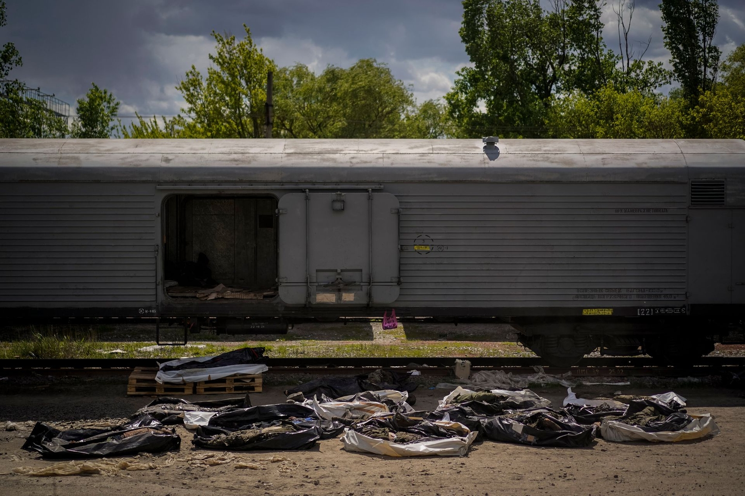 The bodies of Russian soldiers lie on the floor during an identification process in Kharkiv, Ukraine, on May 17, 2022.