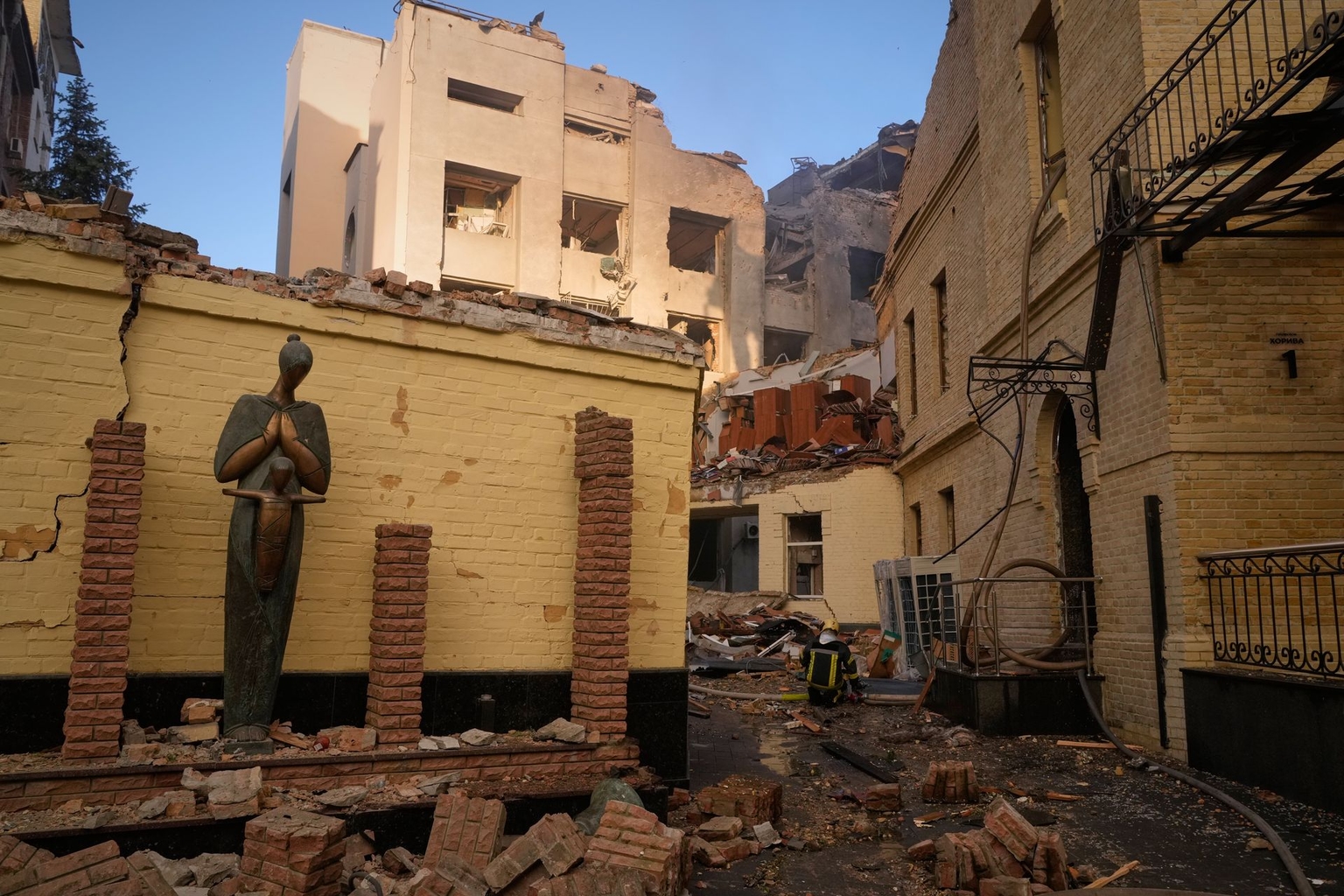 Firefighters work at the damaged Chornobyl Museum following a Russian missile attack in Kyiv, Ukraine, on May 24, 2026. 