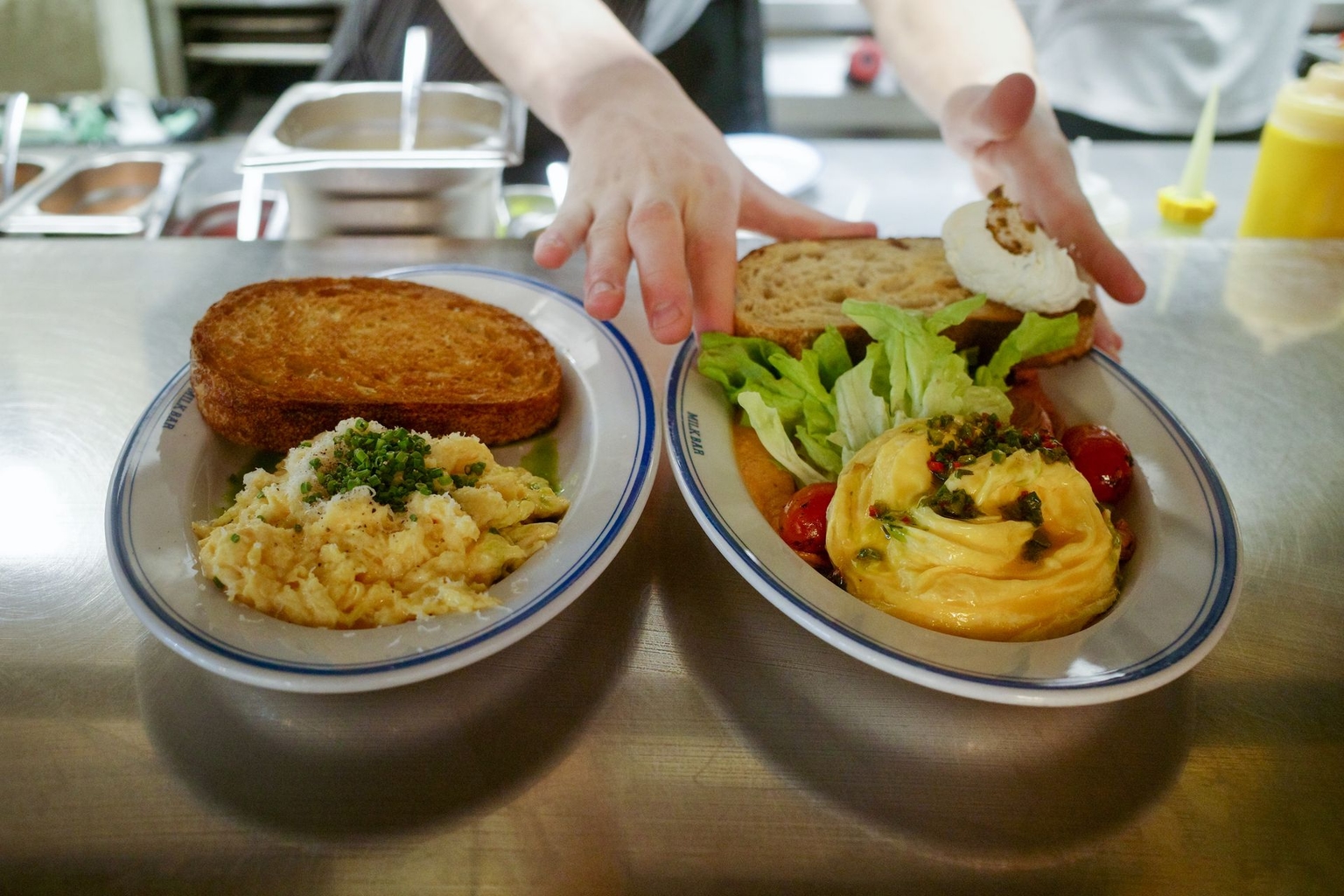 Freshly prepared breakfast dishes at Milk Bar in Warsaw, Poland, on May 15, 2026. 