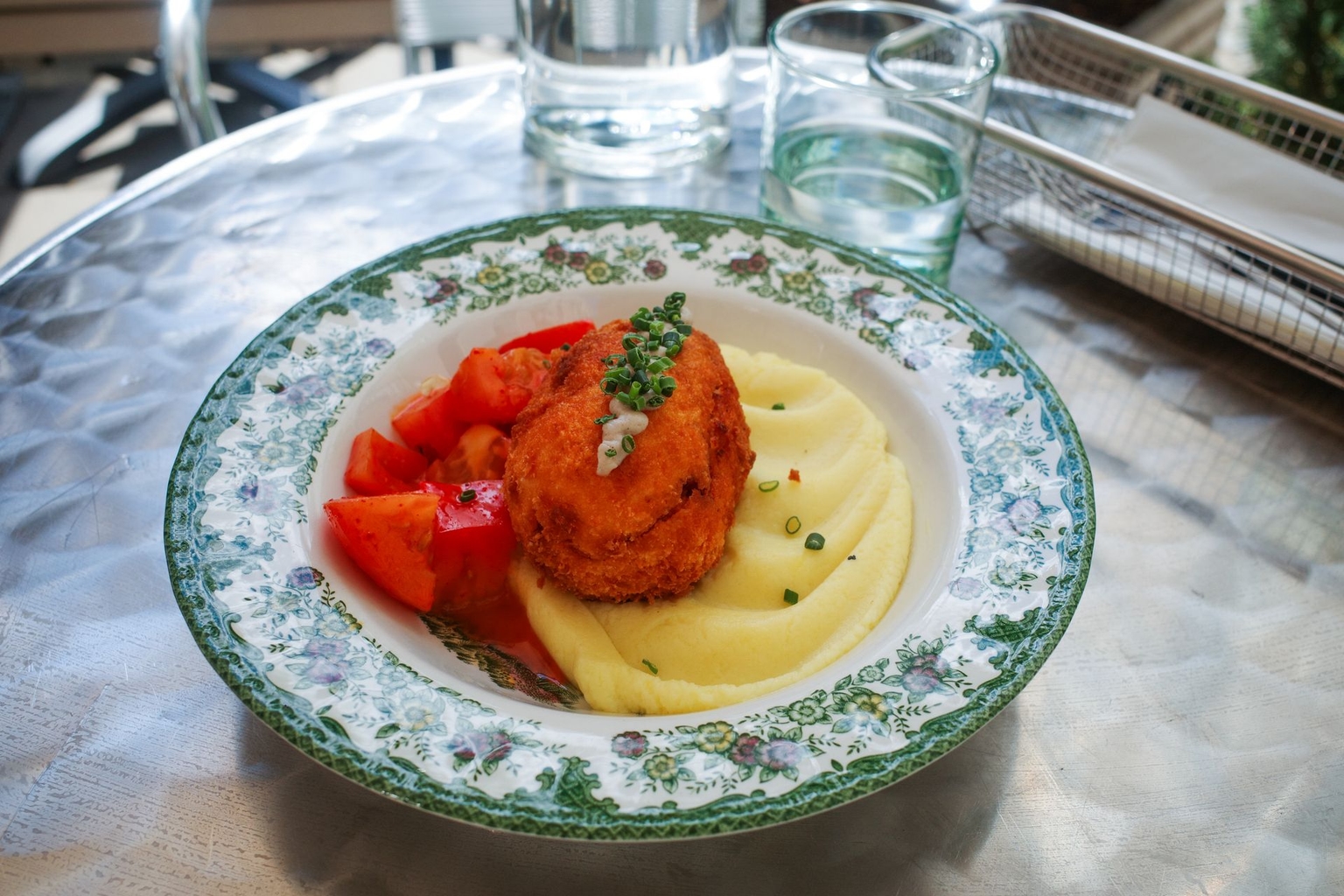 A Chicken Kyiv dish, one of the restaurant's best sellers, is served on the terrace at Sour in Warsaw, Poland, on May 28, 2026. 