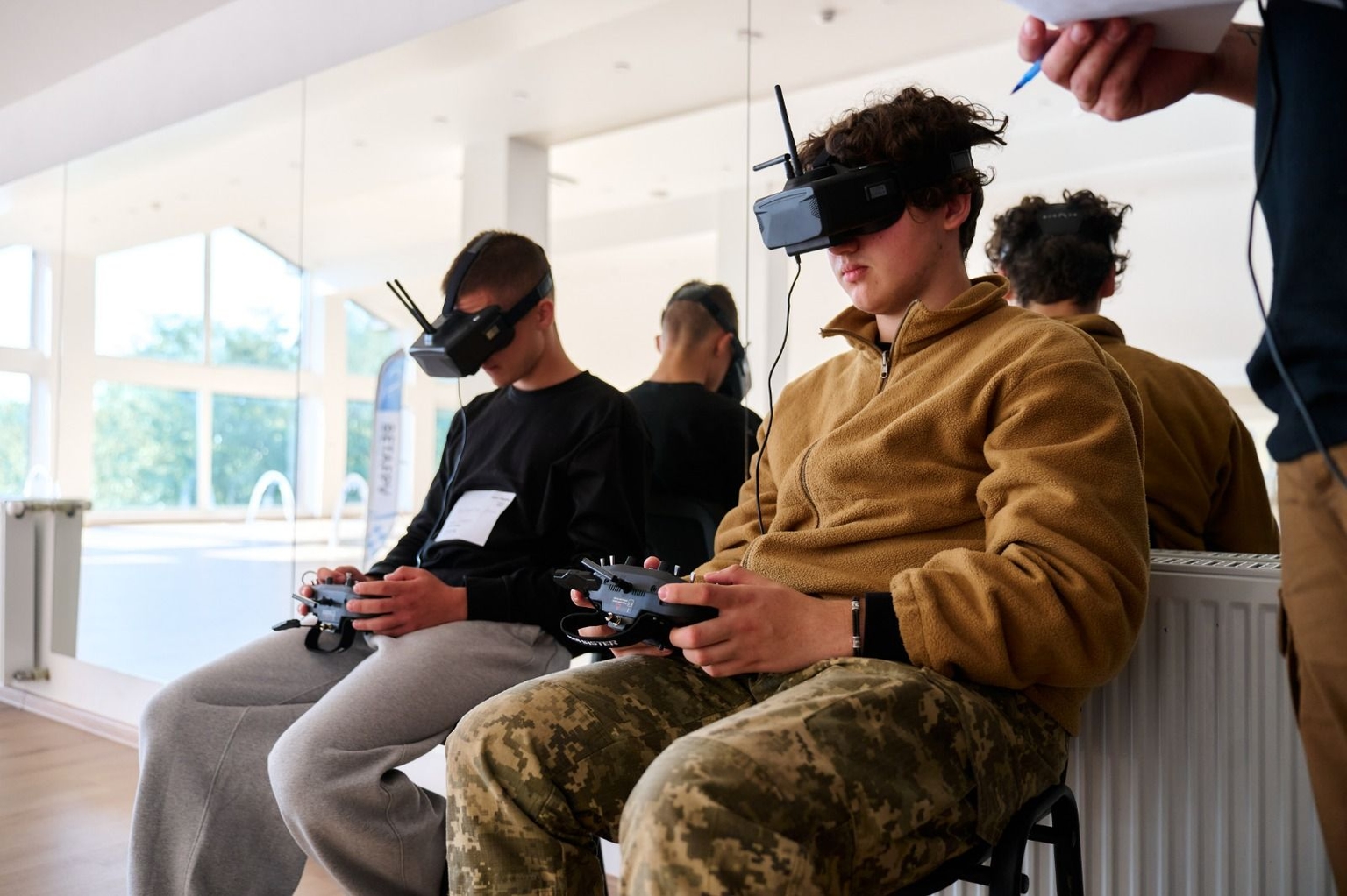 Students learn how to fly a drone during training in Ukraine in 2026.