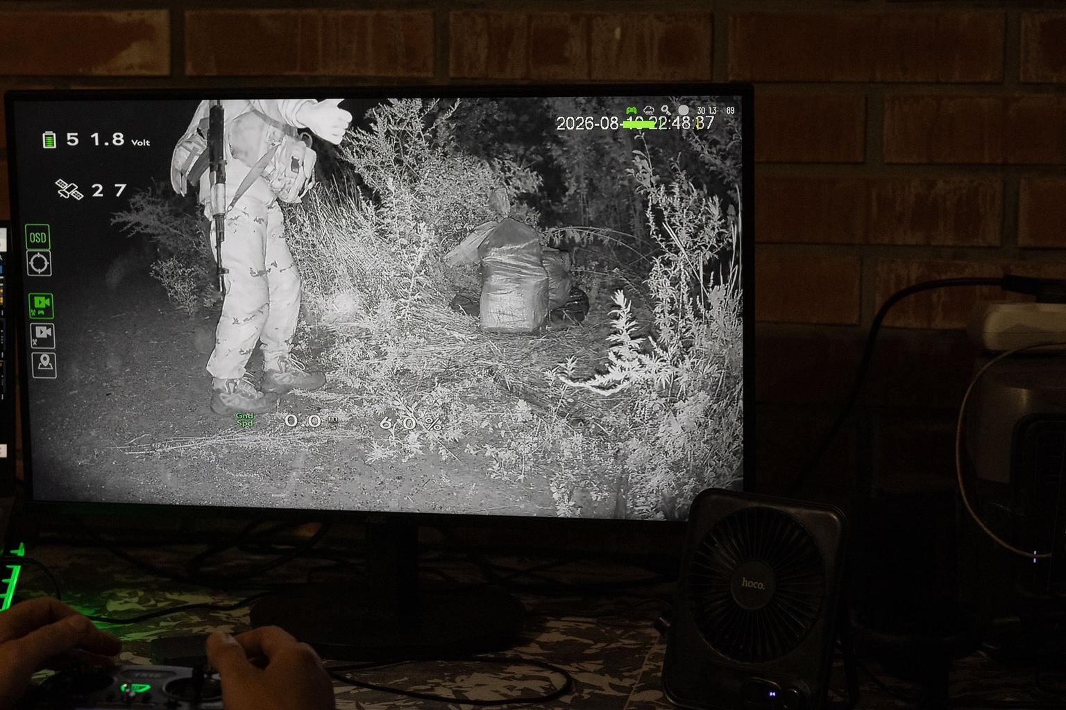 A soldier gives Kuzya a thumbs-up on a screen in the Lyman sector, Ukraine, on Aug. 10, 2026.