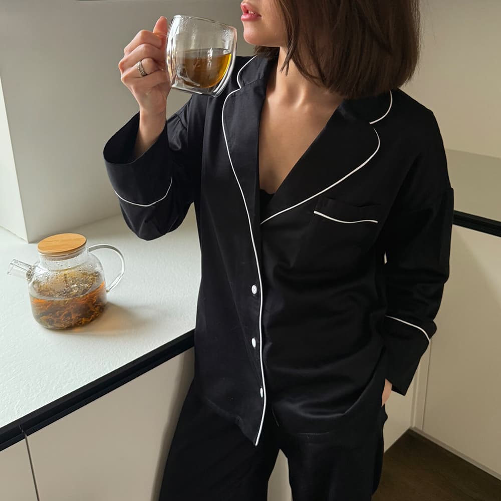 Black satin pajamas by Ukrainian brand Bedclozzzes