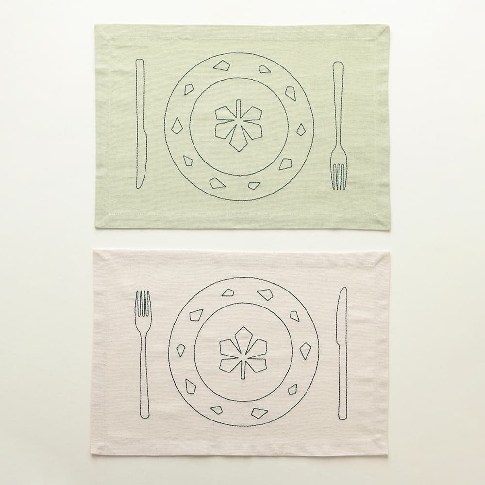Embroidered chestnut placemats by Ukrainian brand Serve It