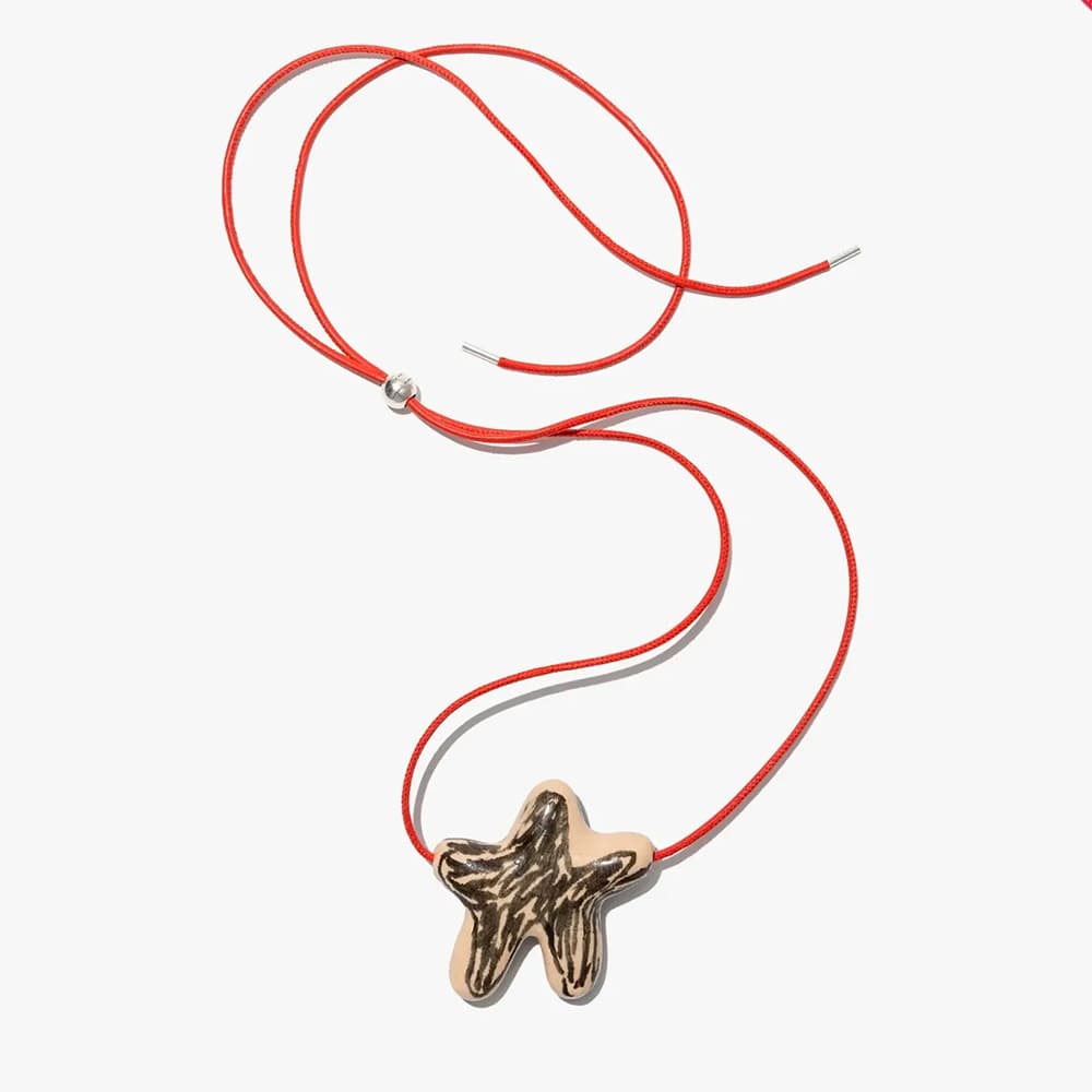 Hand painted pendant necklace by Ukrainian brand Tsvite Teren