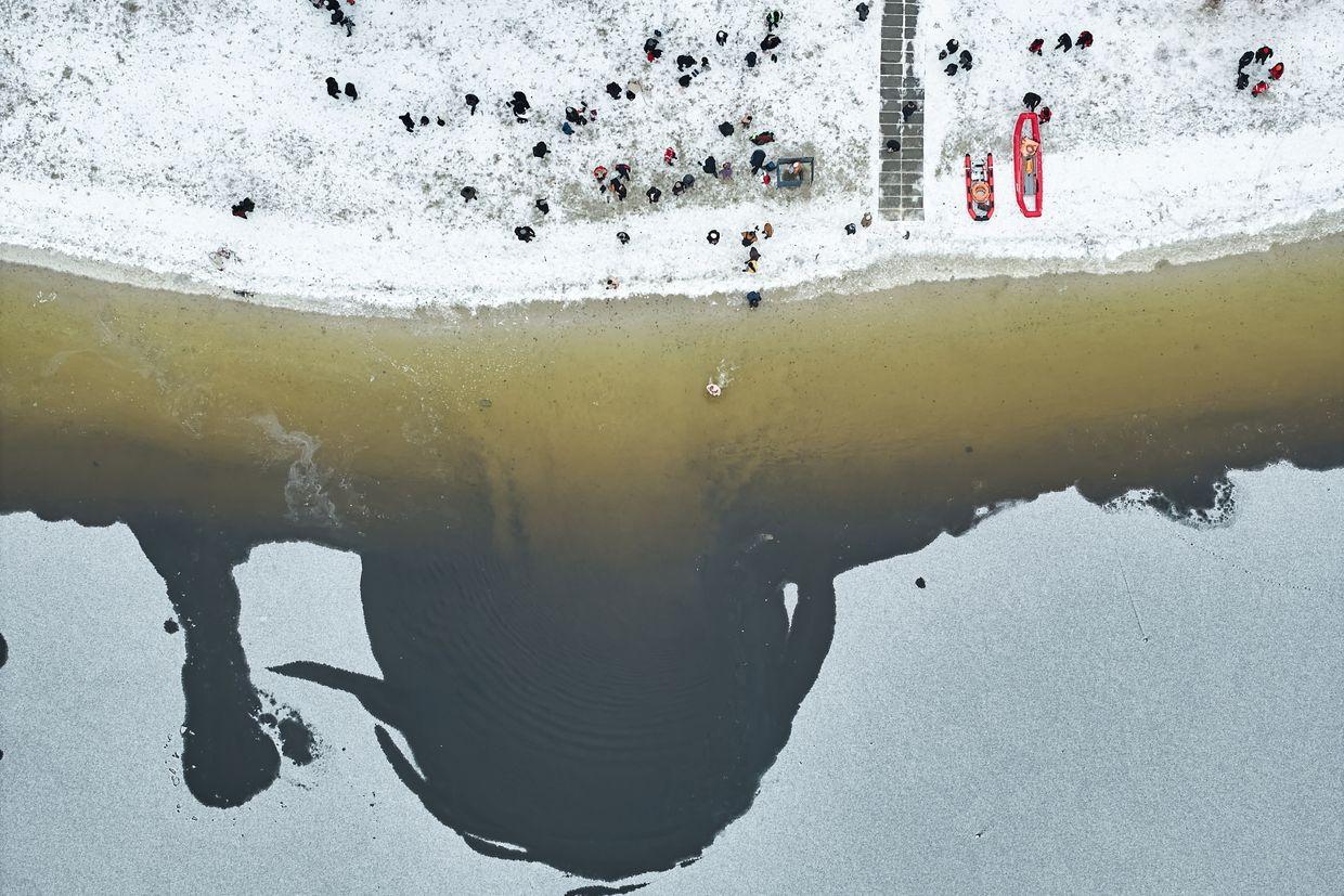 Ukrainians plunge into icy water on Epiphany (Photos)