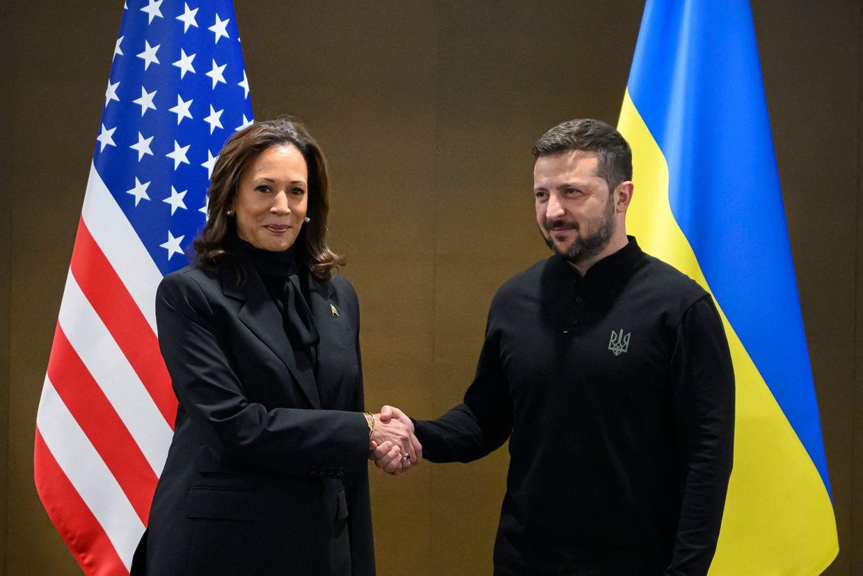 US Vice President Kamala Harris (L) shakes hands with Ukraine's President Volodymyr Zelensky during