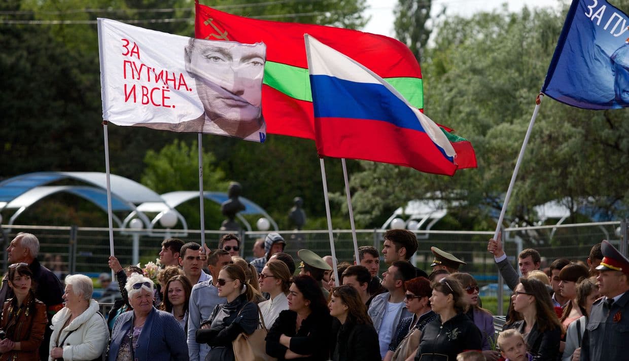 Russian flag and a flag with a portrait of Putin reading “We are for Putin!” in Transnistria, Moldova, on May 9, 2014. 