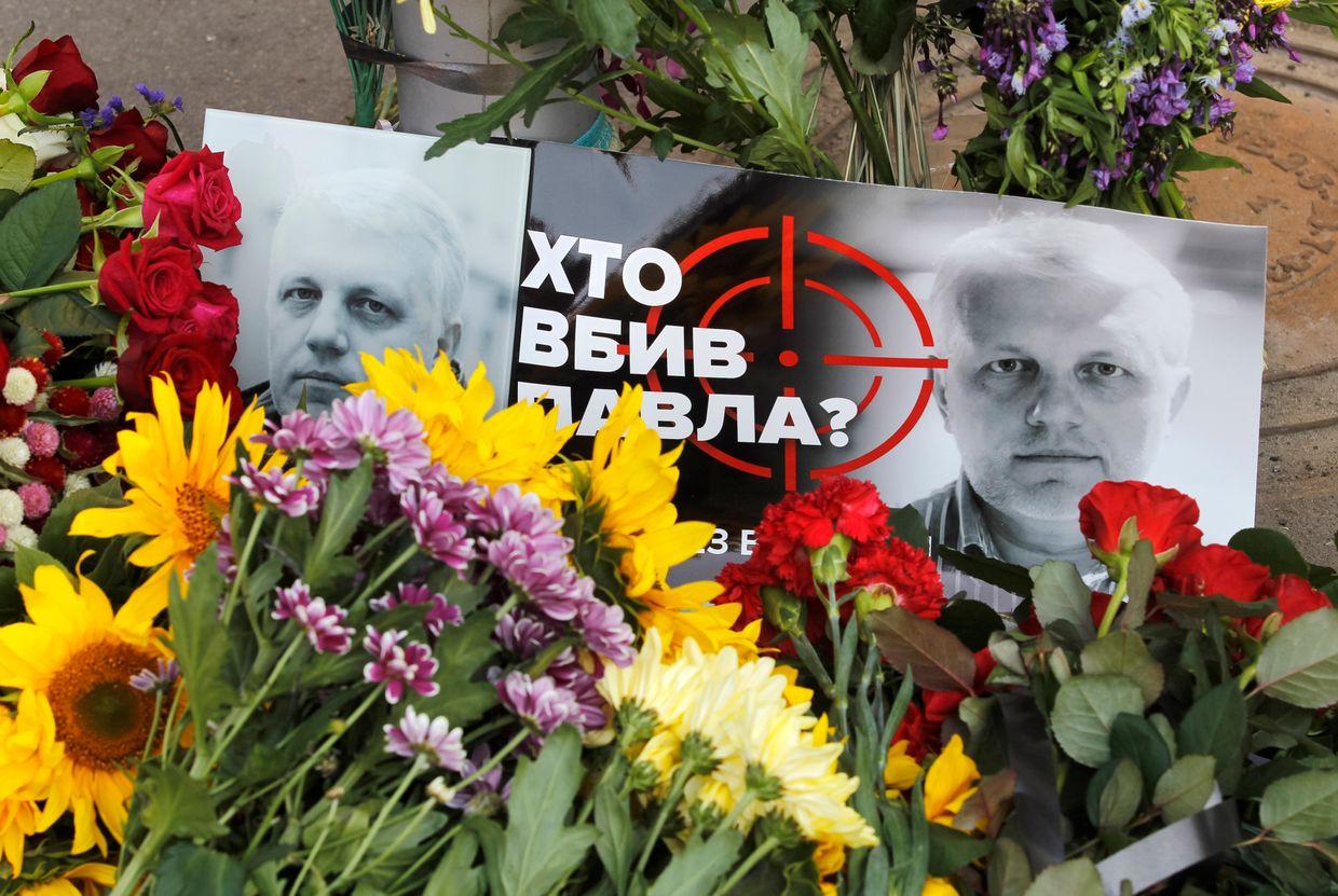 A view of flowers and portraits of journalist Pavel Sheremet during a death anniversary in Kyiv, Ukraine