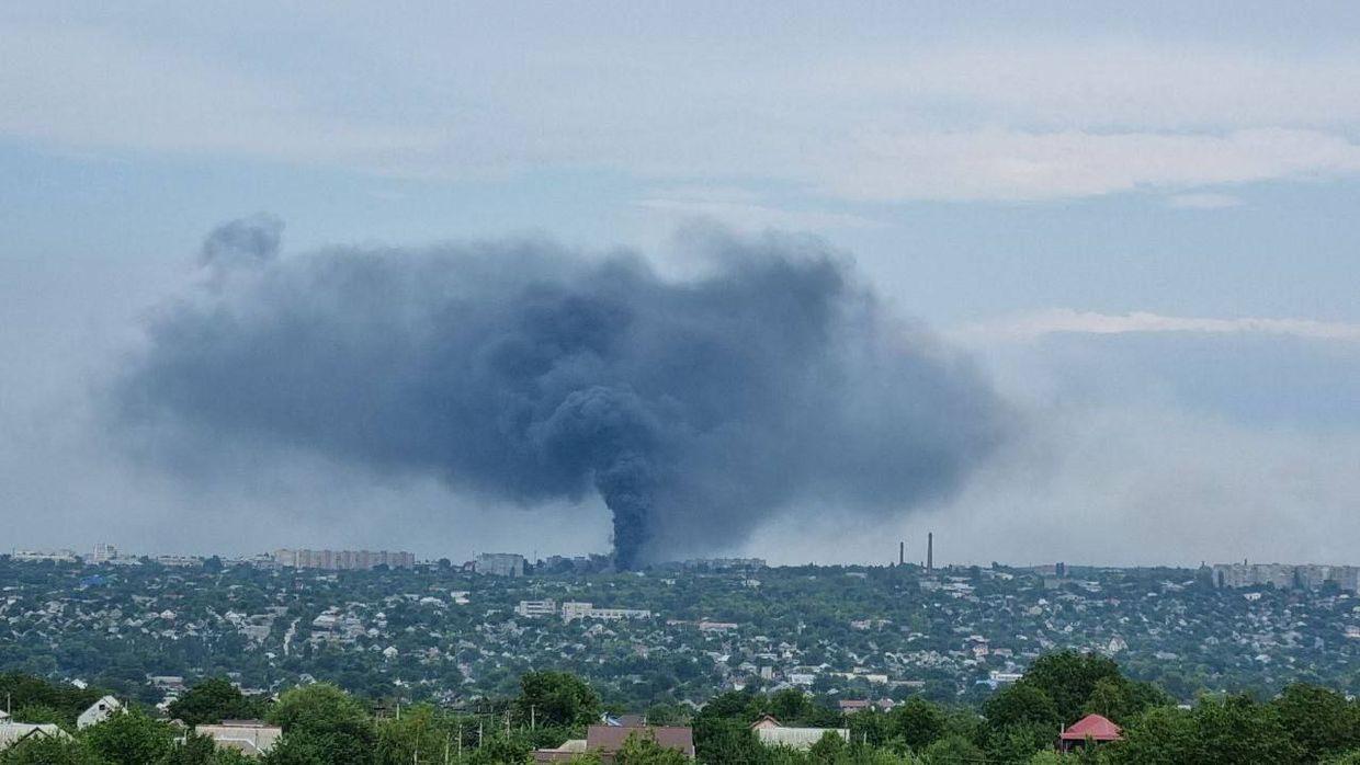 A smoke rising over the Factory 100 machine repair plant in Luhansk.