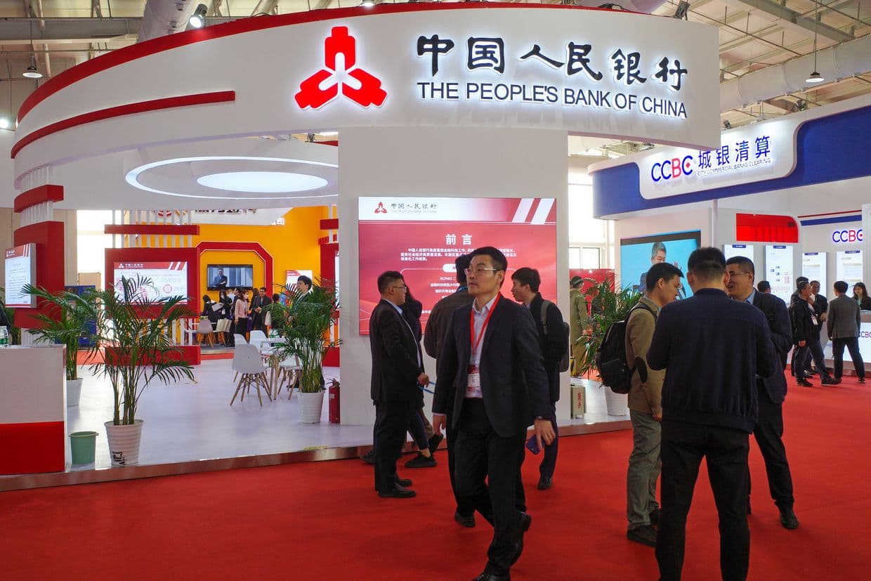 People visit the booth of People's Bank of China during the China International Financial Exhibition