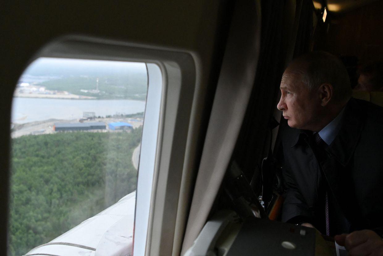 Russian President Vladimir Putin flies in a helicopter