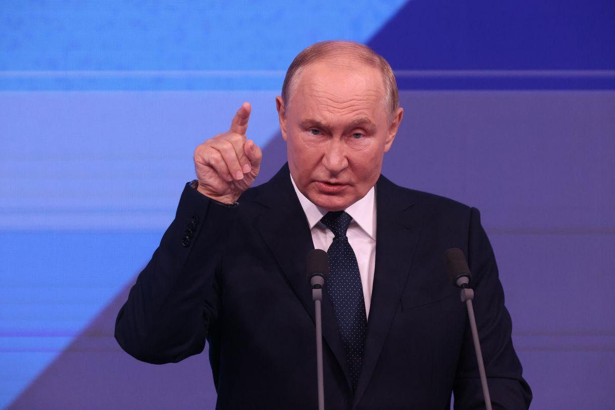 Russian President Vladimir Putin gestures during his speech at the meeting in Moscow, Russia