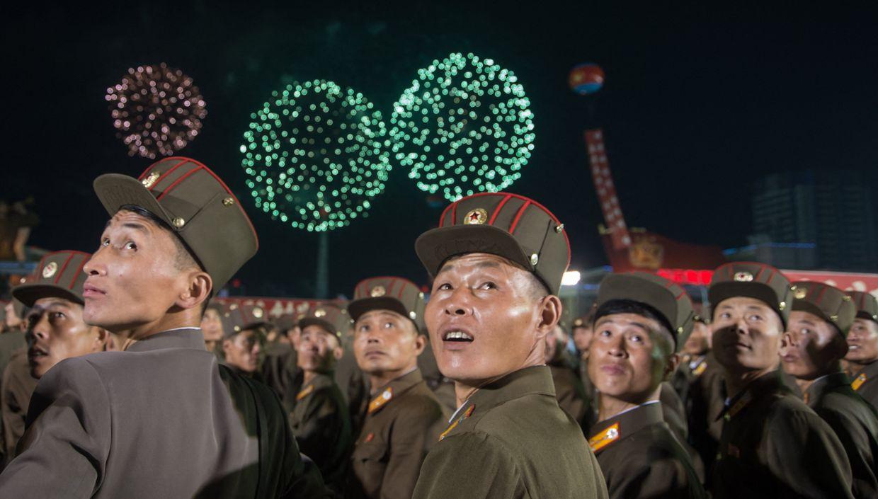 KPA soldiers cheer during a mass celebration for scientists behind North Korea's largest nuclear blast on Sep. 6, 2017. 