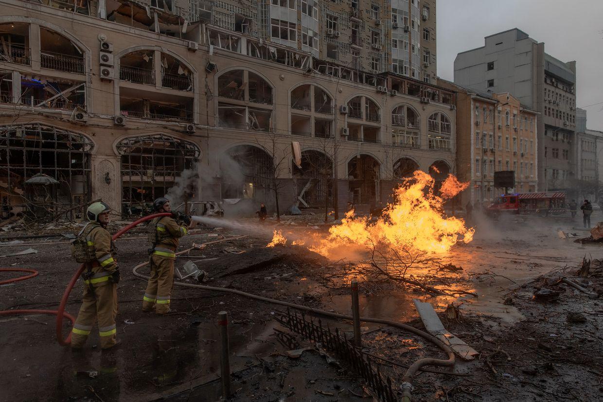 Ukrainian firefighters try to extinguish a fire on the site of a Russian missile attack in Kyiv, Ukraine, on Dec. 20, 2024