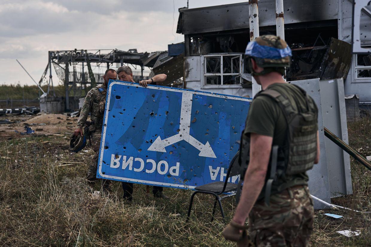 A destroyed border checkpoint with signs reading "Ukraine" and "Russia" in Kursk Oblast, Russia, on Aug. 16, 2024.