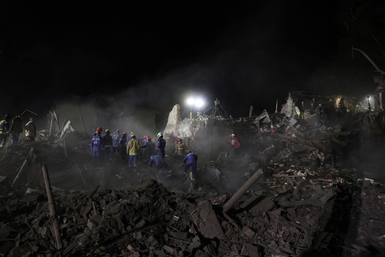 Ukrainian rescuers operate at the site of a Russian missile attack in Kyiv, Ukraine, on April 24, 2025