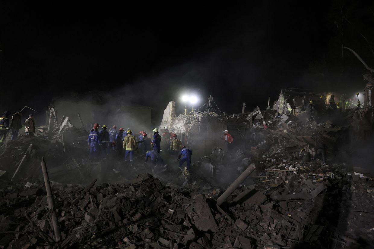 Ukrainian rescuers operate at the site of a Russian missile attack in Kyiv, Ukraine, on April 24, 2025