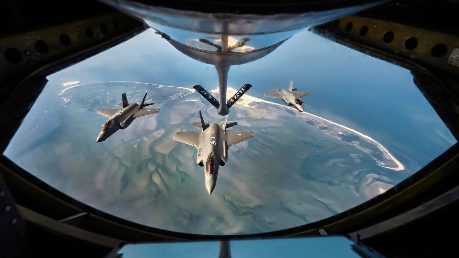 Royal Netherlands Air Force F-35 fighter jets fly in formation above the Wadden Sea in the Netherlands on April 28, 2025. 